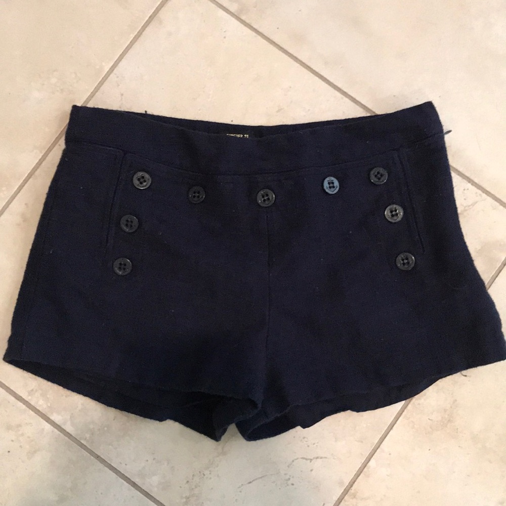 Navy blue zip up shorts.